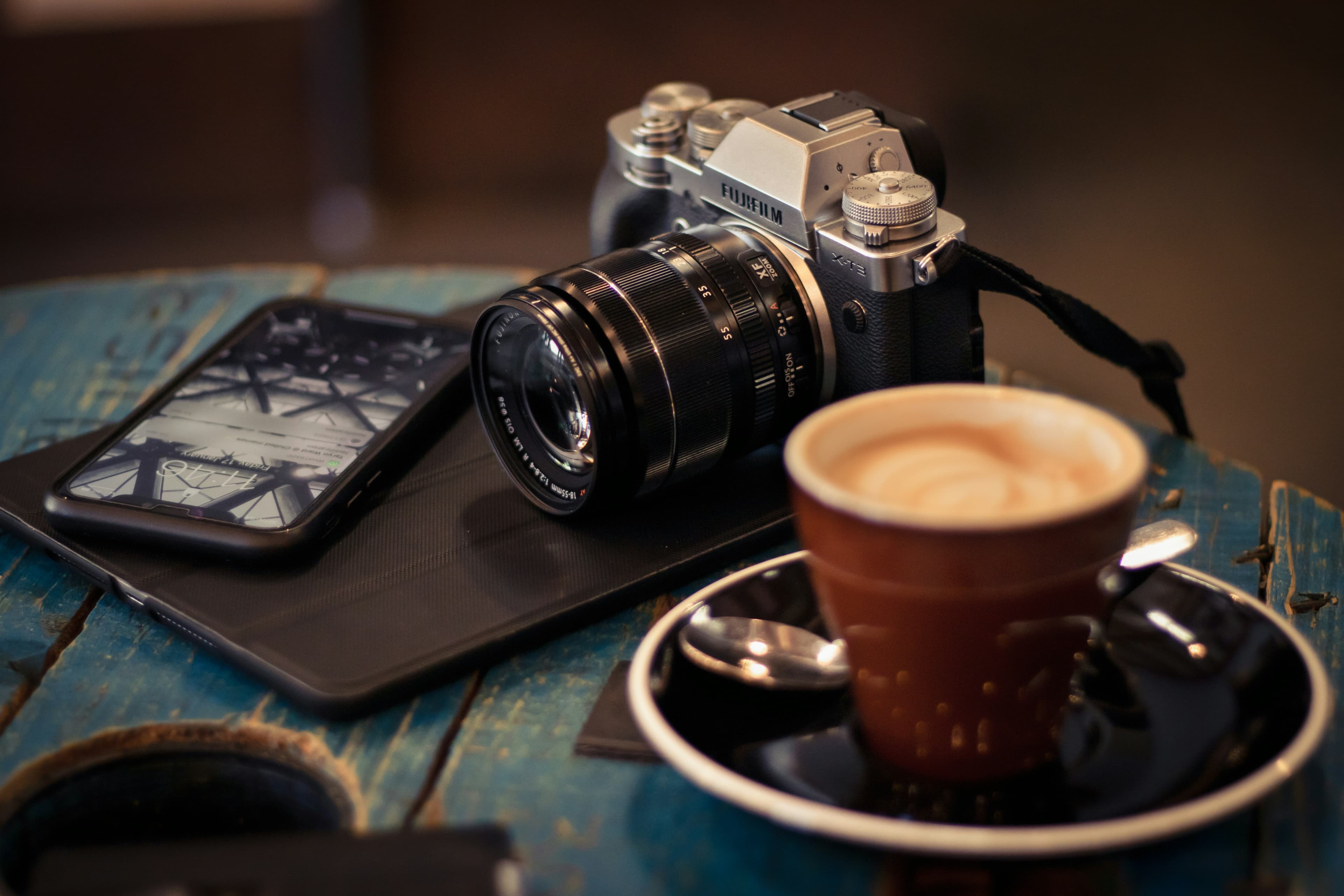 Photography desk with a Fujifilm camera and editing setup