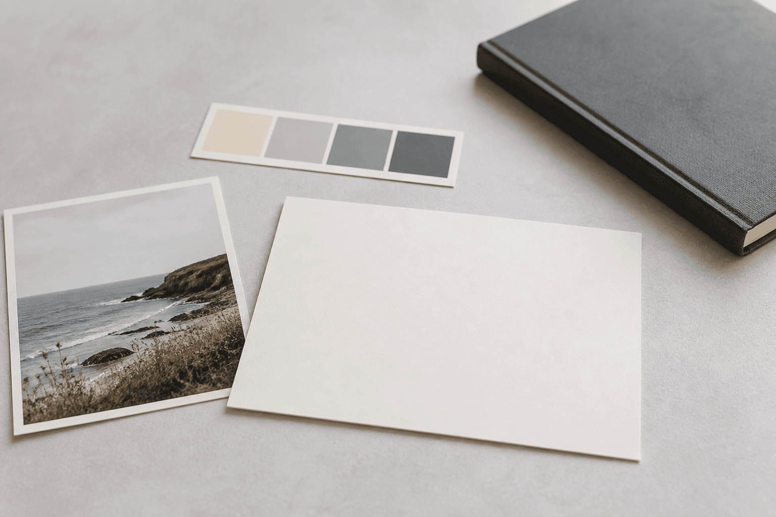 Blank recipe card beside a coastal photo print and simple colour swatches